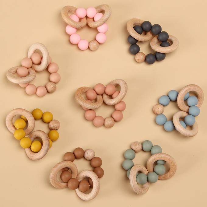 木リング柔らかいおもちゃ7.5*6*4cm Eco友好的なDL13M03 CNが付いている注文の環境に優しい赤ん坊の歯生期のおもちゃBPAの自由なシリコーンTeether;GUA