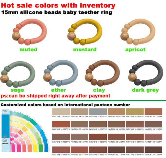 Wholesald BPAのシリコーン リングが付いている歯生期のリングをかみ砕いている自由なシリコーンの赤ん坊